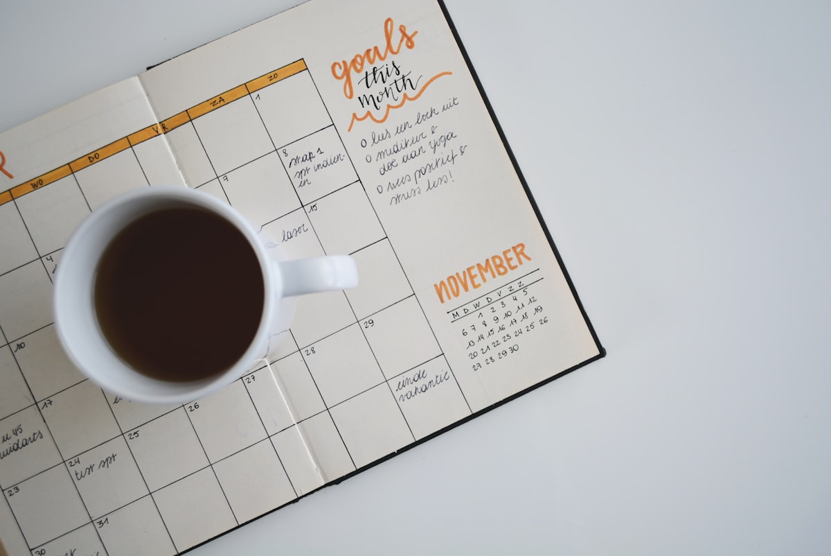 Wedding planning calendar and timeline laid out on a table
