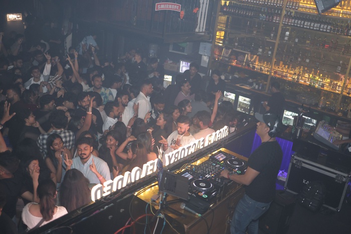 DJ VIC performing at a premium nightclub event